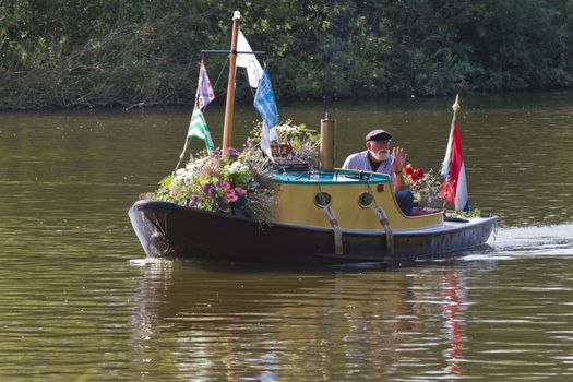 VLAARDINGEN - AUGUST 05: Each year this unique floating parade of beautiful decorated boats sail through the Westland. Theme this year: Theatre on water, August 05, 2011, Vlaardingen, the Netherlands

