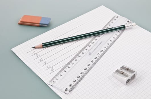 Write training supplies on a white paper with some handwrited single letters