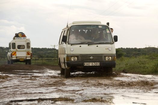 Car crossing a flooded road