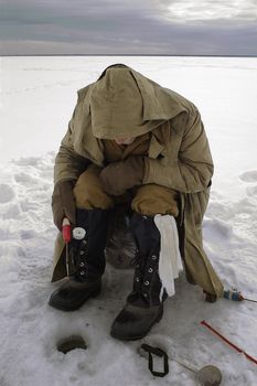 Icefishing. Winter. Ice. Ladoga Lake.