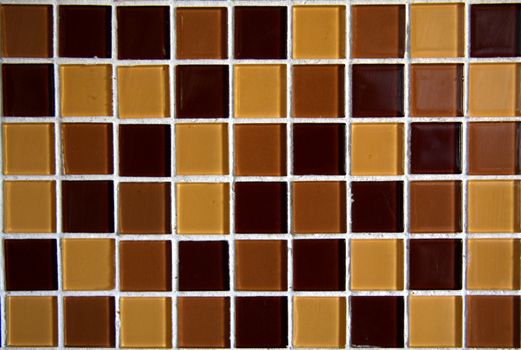 Glass mosaic with different brown colors.