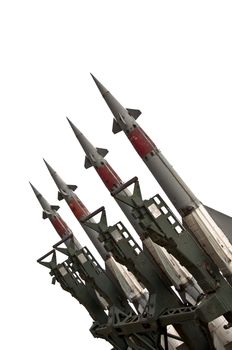 Several combat missiles aimed at the sky. Isolated on a white background. Missile weapons.