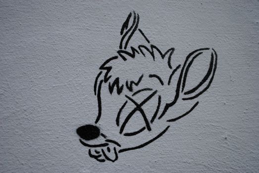 A street art stencil depicting a dead Bambi.