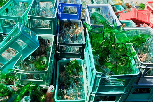 Plastic crates of broken glass bottles