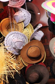 all kind of different hats sombrero and cowboy