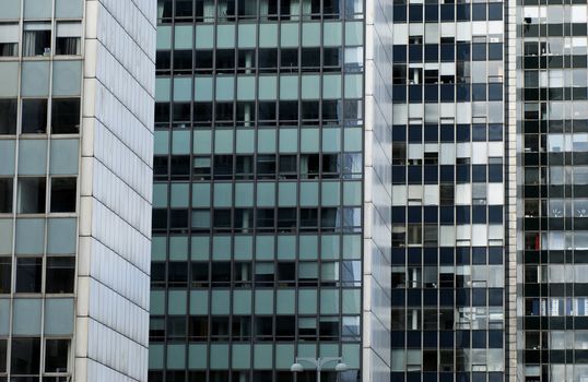 Windows of several office buildings in a row