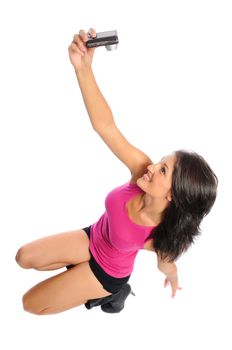 attractive hispanic woman taking a picture of herself on a white background