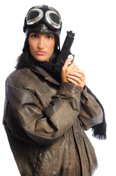 Hispanic woman in a vintage aviator costume holding a gun on a white background