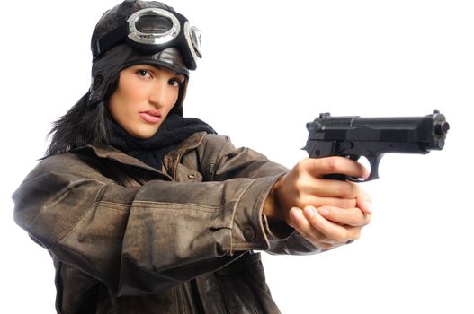 Hispanic woman in a vintage aviator costume holding a gun on a white background