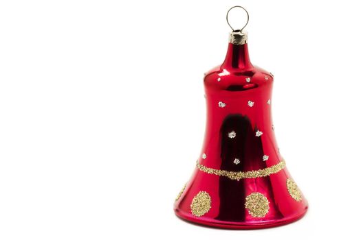 red christmas ornament in bell shape on white background