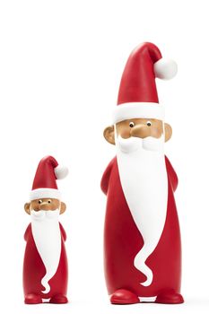 two slender santa figurines on white background