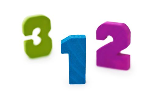 Three wooden toy figures on a white background