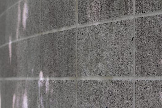Curved gray close up of a concrete block wall