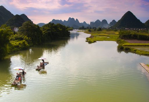 Bamboo Rafts drift down the Li River in Yangshuo, China, 15 July 2010.  National Geographic Magazine have just voted it One of the World's Top Ten Watery Wonders.