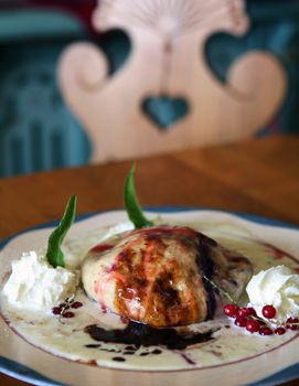 Dumpling with bilberries and vanilla cream, typycal seasonal food from Walachia