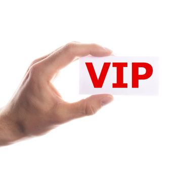 vip or very important person concept with hand and paper