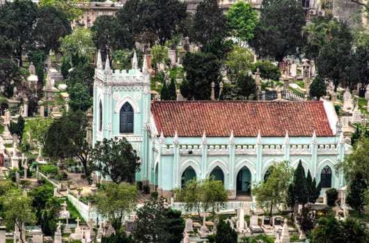 Churchyard in Macao. Church with tombs and graves.