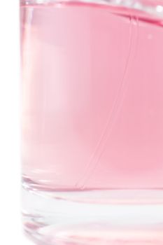 Transparent perfume bottle isolated on while background.