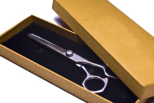 Special scissors for work of hairdresser in box