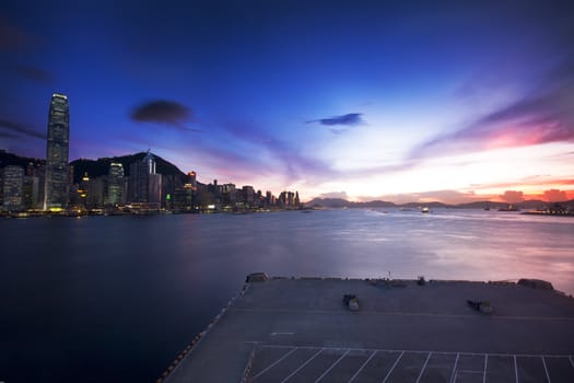 Hong Kong cityscape in sunset and dock