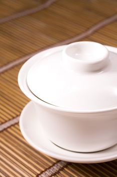 white teacup on wooden table for texture