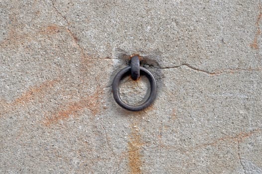Ring on a wall for attaching a chain