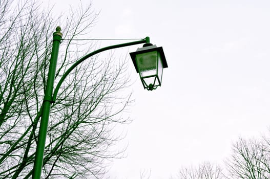 A vintage traditional street lamp light in an alley
