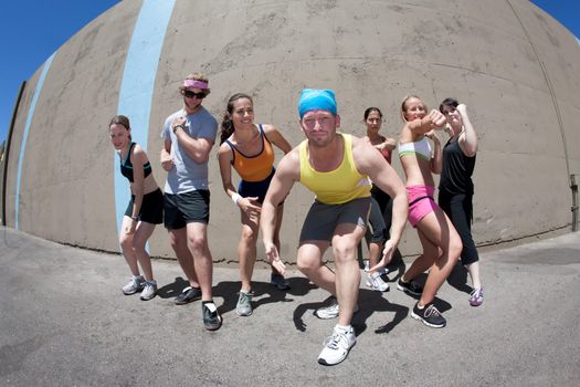 Attractive young athletes posing and flexing their muscles