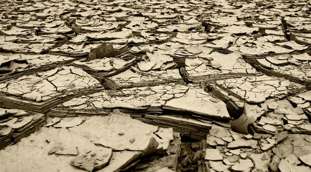 dried mud and river silt following huge flood disaster queensland