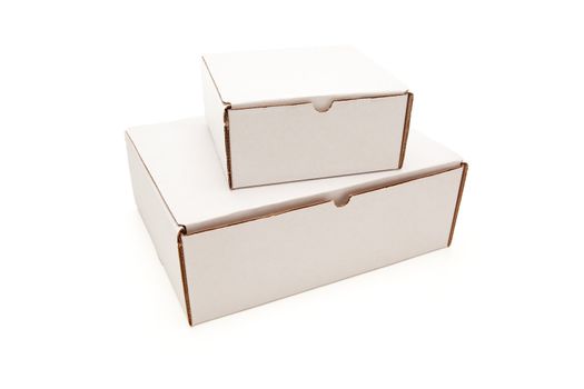 Stack of Blank White Cardboard Boxes Isolated on a White Background.