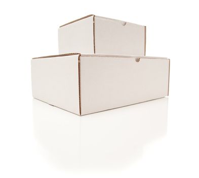Stack of Blank White Cardboard Boxes Isolated on a White Background.