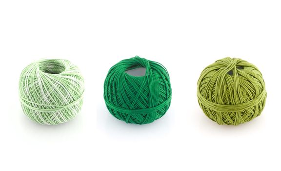 spools of many colors on a white background.