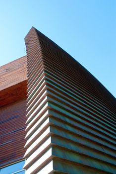Abstraction of curves for modern building on a clear blue sky.