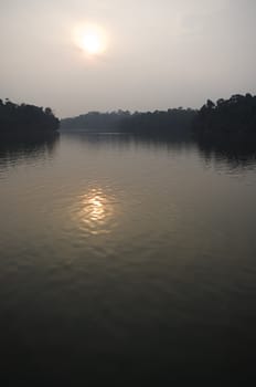 sun reflection on a lake, in a hazy day