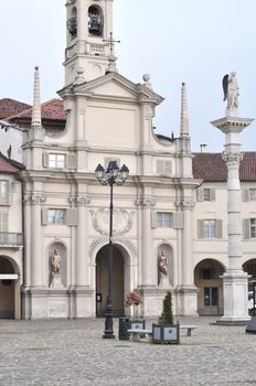 Piazza dell Annunziata square in Venaria Reale with Nativita di Maria church, Turin, Italy