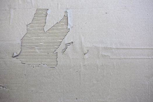 The oThe old torn cardboard banner, in monochromeld torn cardboard banner, in monochrome