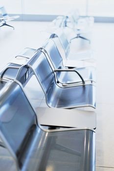 Row of metal chairs in the airport