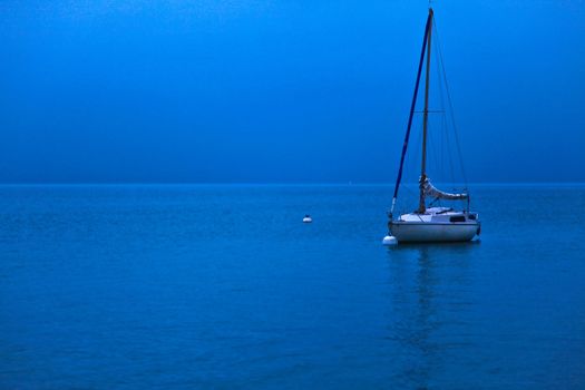 A sailboat in the morning at Lake Geneva, Switzerland