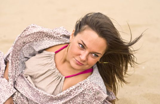 Cute attractive women smiling at the beach. Summer portrait. Blurring background.