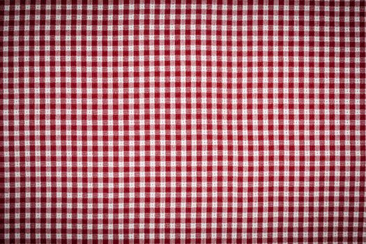 Red and White Gingham Checkered Picnic Blanket Tablecloth Background with Vignette.