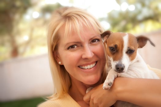 Attractive Woman and Her Jack Russell Terrier Dog Outdoors with Selective Focus.
