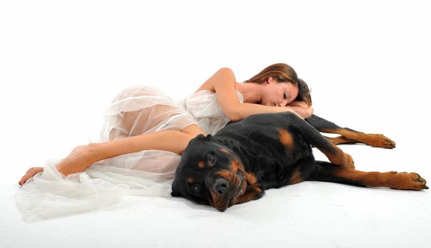 sleeping young bride and her purebred rottweiler 