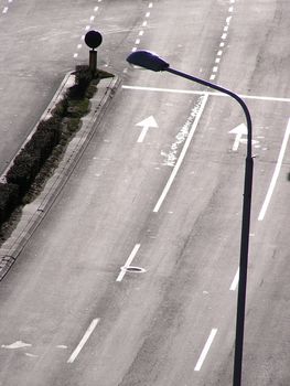 Empty traffic lines and street light at sunny morning.