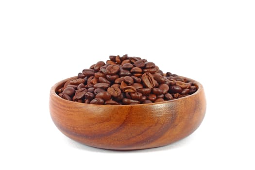 Coffee beans in wooden bowl isolated on white