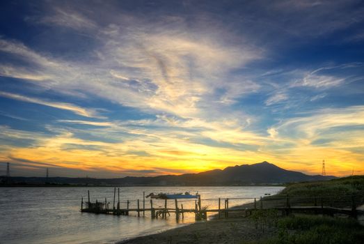 Beautiful pier scenery with dramatic clouds in sky in Taipei city, Taiwan.