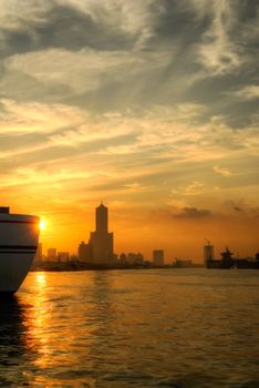 City morning in Kaohsiung dock with silhouette of skyscraper and buildings, Taiwan.