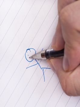 Doodling a small blue stickman on white lined paper with a pen