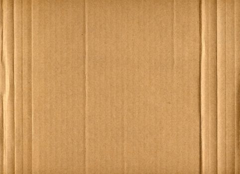 Brown corrugated cardboard sheet useful as a background