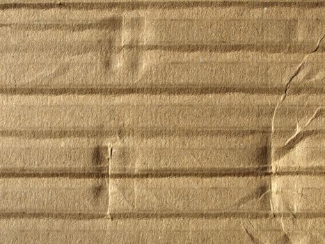 Brown corrugated cardboard sheet background material texture