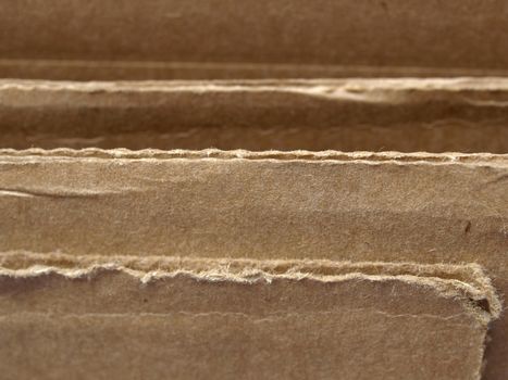 Brown corrugated cardboard sheet useful as a background